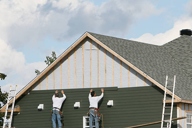Professional Siding technician working in Linwood, NC